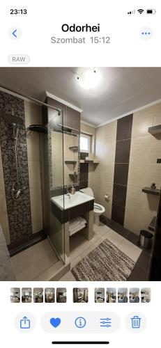 a bathroom with a shower and a sink at Family Apartman in Odorheiu Secuiesc