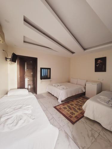 Postel nebo postele na pokoji v ubytování shah sultan Ozturk Hotel