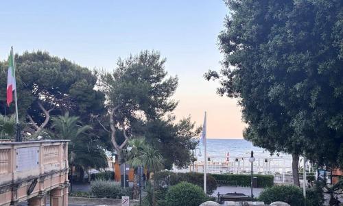 a view of the ocean from a street with trees at Dimore di Mare in Arenzano