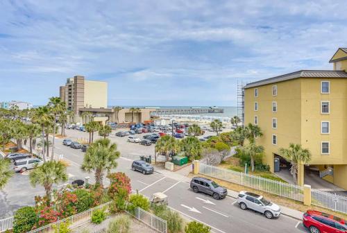 a parking lot with cars parked in a parking lot at San Souci By The Sea - Your Folly Beach Oasis in Folly Beach