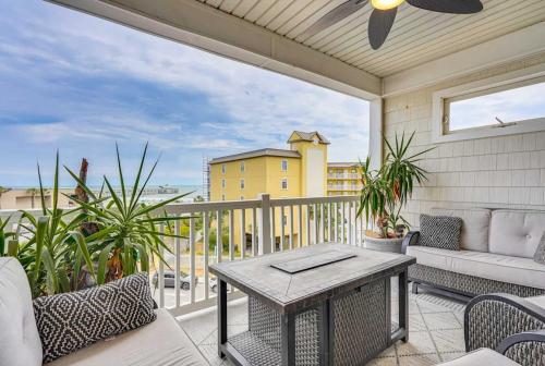 a patio with a table and chairs on a balcony at San Souci By The Sea - Your Folly Beach Oasis in Folly Beach