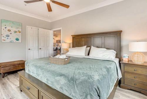 a bedroom with a large bed with a wooden headboard at San Souci By The Sea - Your Folly Beach Oasis in Folly Beach