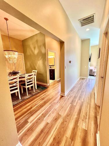 a living room with a table and a dining room at Downtown, Roof Deck, Parking in Saugatuck