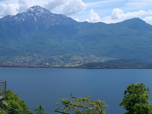 a large body of water with a mountain in the background at Naturstein-Rustiko Casa Marie in Vercana