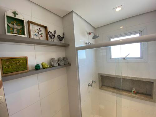 a bathroom with a shower and a glass shower stall at 20 floor perfect view Brooklin in Sao Paulo