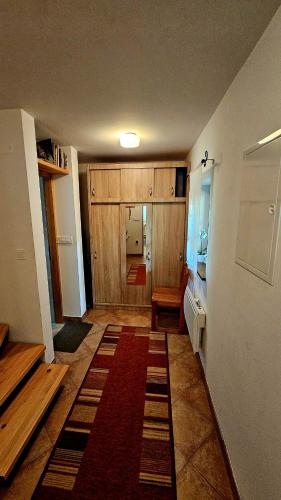 a room with a hallway with a rug on the floor at Country House Srček in Bizeljsko
