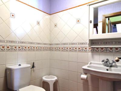 a bathroom with a toilet and a sink at Casa Chaparrete in Deza