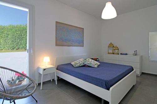 En eller flere senge i et værelse på Villa Ippocampo