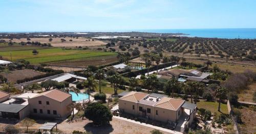 an aerial view of a house with a pool at L'Oasi del Mediterraneo in Sampieri