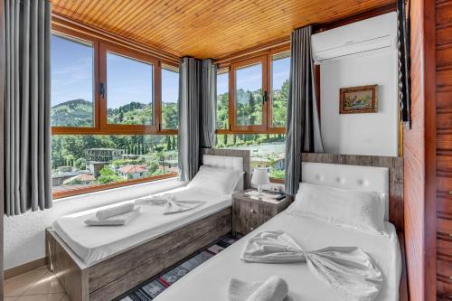 Postel nebo postele na pokoji v ubytování Guesthouse Emiljano