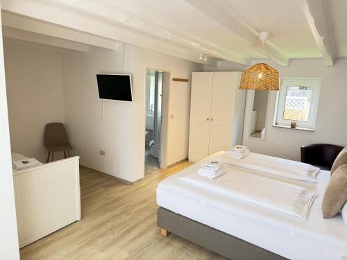 Postel nebo postele na pokoji v ubytování FRISIA NORDD Norddeich