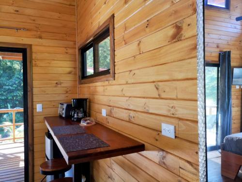 a log cabin with a wooden wall at Thoas Lodge in Coronado