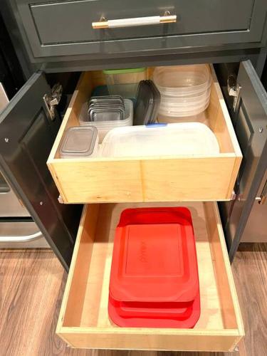 an open drawer with a red box in a refrigerator at Remodeled Excellent Neighborhood in Roseville