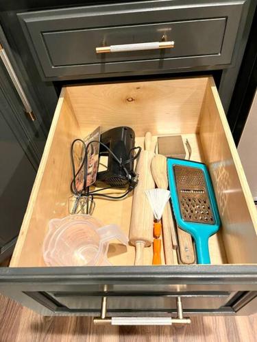 a drawer full of kitchen utensils on a table at Remodeled Excellent Neighborhood in Roseville
