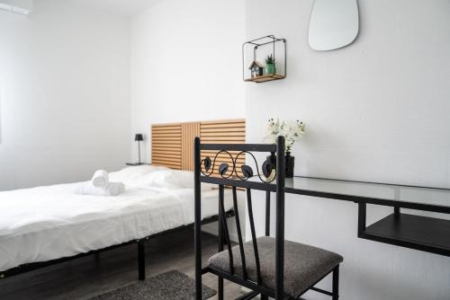 Katil atau katil-katil dalam bilik di Ma Parenthèse Confortable à deux pas de Paris