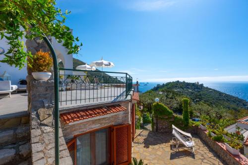 a balcony of a house with a view of the ocean at Villa Marianna in Massa Lubrense