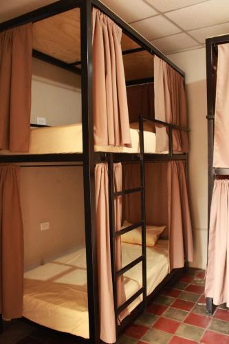 Postel nebo postele na pokoji v ubytování Hostal Casa Nómada