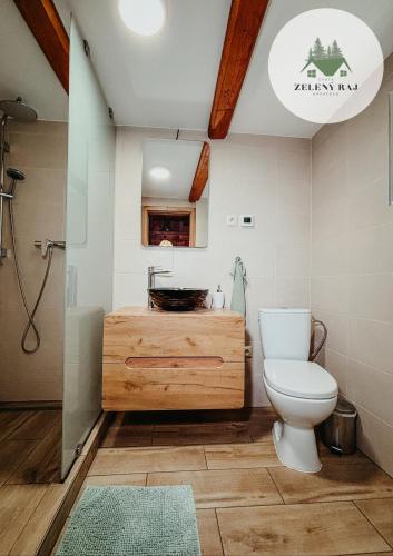 a bathroom with a toilet and a sink at Chata Zelený raj in Horná Lehota