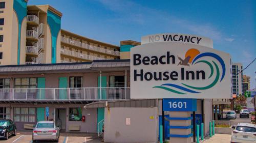 a no vacancy sign in front of a beach house inn at Beach House Inn in Daytona Beach