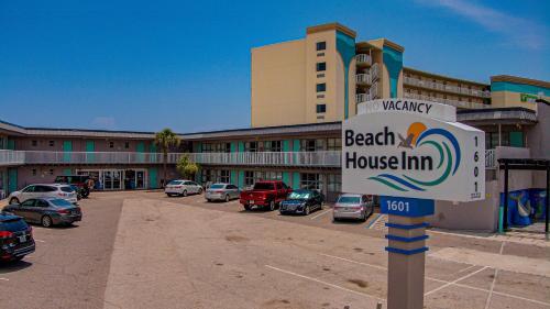 a street sign in front of a beach house inn at Beach House Inn in Daytona Beach
