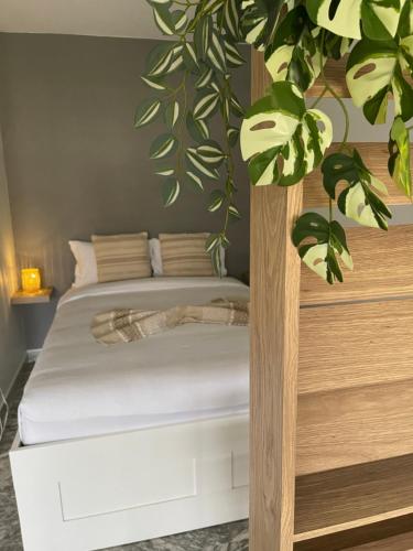 Ένα ή περισσότερα κρεβάτια σε δωμάτιο στο Charming green studio