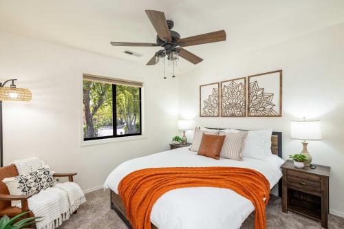 a bedroom with a bed and a ceiling fan at Happy Trails Flagstaff in Flagstaff