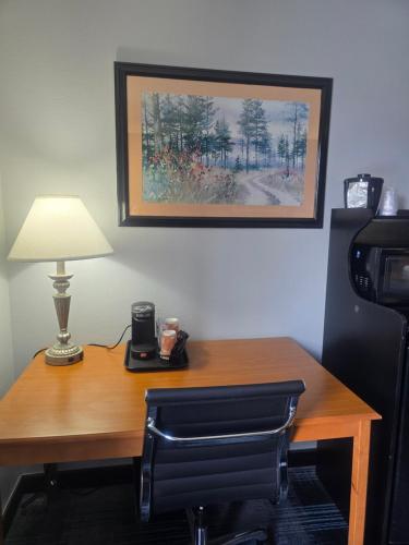 a desk with a lamp and a telephone on it at Quality Inn Dublin I-81 in Dublin