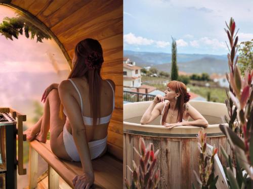 a woman sitting in a bath tub on a balcony at Quinta de Raj - Your Douro Valley Retreat in Peso da Régua