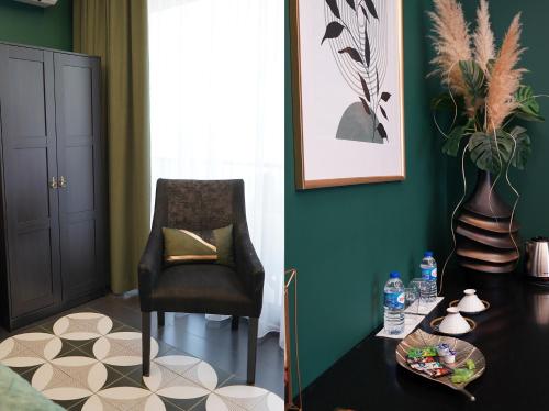 a living room with a chair and a table at Quinta de Raj - Your Douro Valley Retreat in Peso da Régua