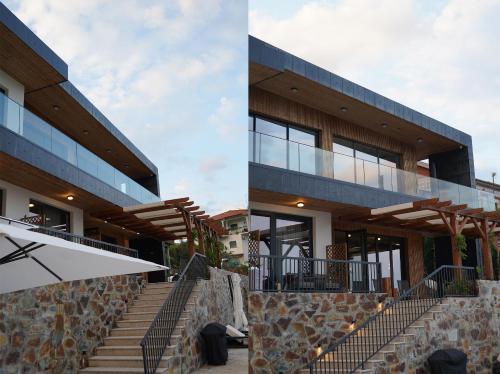 an external view of a building with stairs and windows at Quinta de Raj - Your Douro Valley Retreat in Peso da Régua