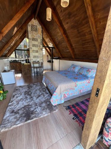 En eller flere senge i et værelse på CHALÉS VILA RICA - Bar do Ricardo