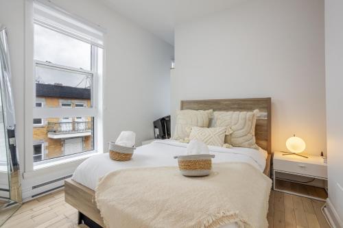 Ένα ή περισσότερα κρεβάτια σε δωμάτιο στο Outstanding 1BR village downtown MTL