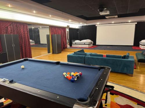 a pool table in a room with a ball on it at The Bishop in London