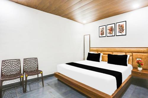 Postel nebo postele na pokoji v ubytování Hotel O The signature stay