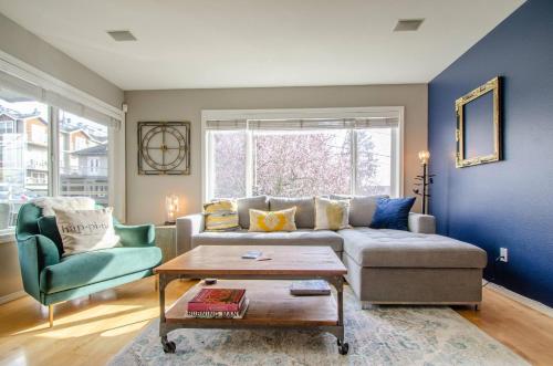 a living room with a couch and a table at Gorgeous Queen Anne Townhouse - Rooftop Deck! in Seattle