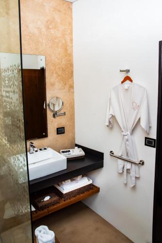 a bathroom with a sink and a mirror at Hotel Boutique Casa Madero in Morelia