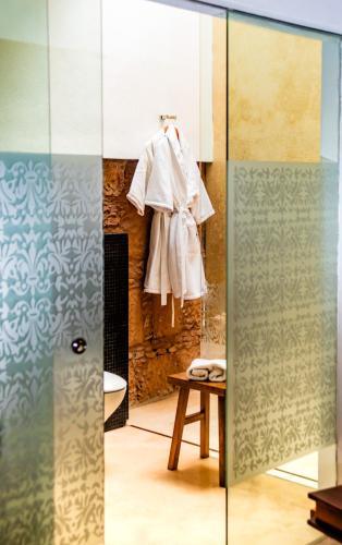 a robe hanging on a wall in a room at Hotel Boutique Casa Madero in Morelia