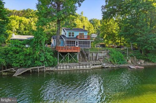 a large house on the bank of a river at Rivers Edge - On the River, Breathtaking views! in Front Royal