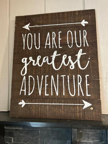 a sign that says you are our first adventure at Rivers Edge - On the River, Breathtaking views! in Front Royal