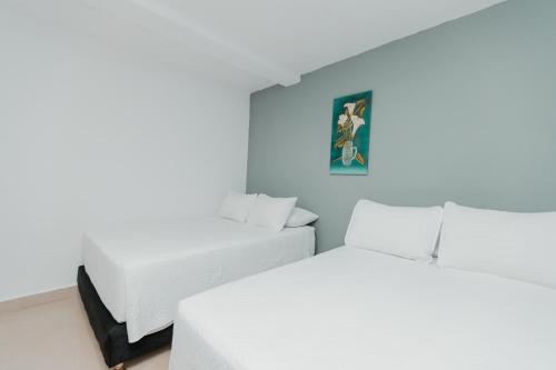 Postel nebo postele na pokoji v ubytování Hotel Molino de Viento