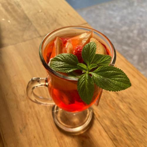 a glass cup of tea with a plant in it at cabañas campestres buena vista in Paicol