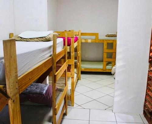 Postel nebo postele na pokoji v ubytování Canoa Roots Hostel & Camping