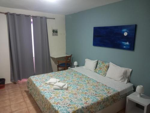 Postel nebo postele na pokoji v ubytování Sao Jose Guesthouse