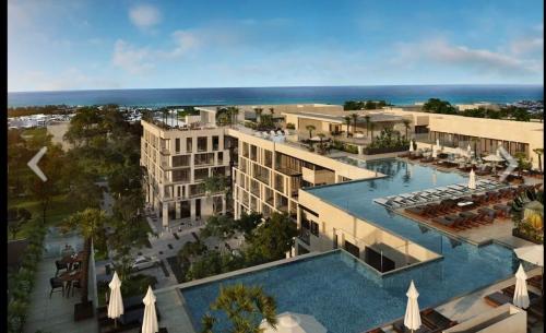 an aerial view of a resort with a swimming pool at Ipana Luxury by Felix in Playa del Carmen