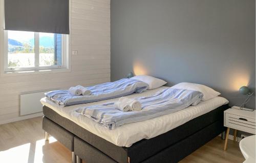 a bedroom with two beds with towels on them at 2 Bedroom Lovely Home In Ørsta in Ørsta