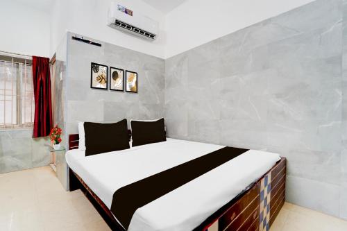 Postel nebo postele na pokoji v ubytování Super Hotel O Coimbatore Hopes College