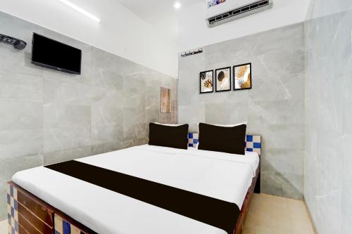 Postel nebo postele na pokoji v ubytování Super Hotel O Coimbatore Hopes College