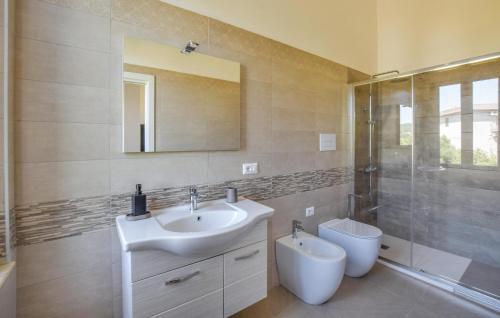 a bathroom with a sink and a shower and a toilet at 5 Bedroom Nice Home In Bovalino in Bovalino Marina