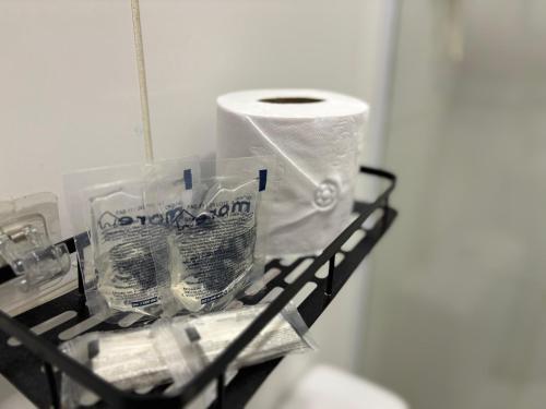 a shelf with a roll of toilet paper on it at Ház Jardim Guanabara in Rio de Janeiro