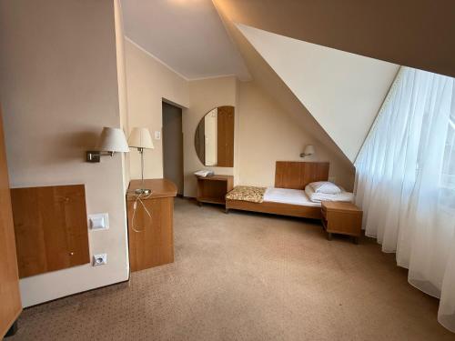 Katil atau katil-katil dalam bilik di Przystań Ostróda - pokoje i apartamenty